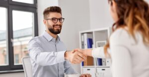 Recrutier smiling with a handshake