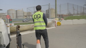 DQS Security guard watching the gate of a parking lot. Read on to learn 5 reasons to choose DQS Security.